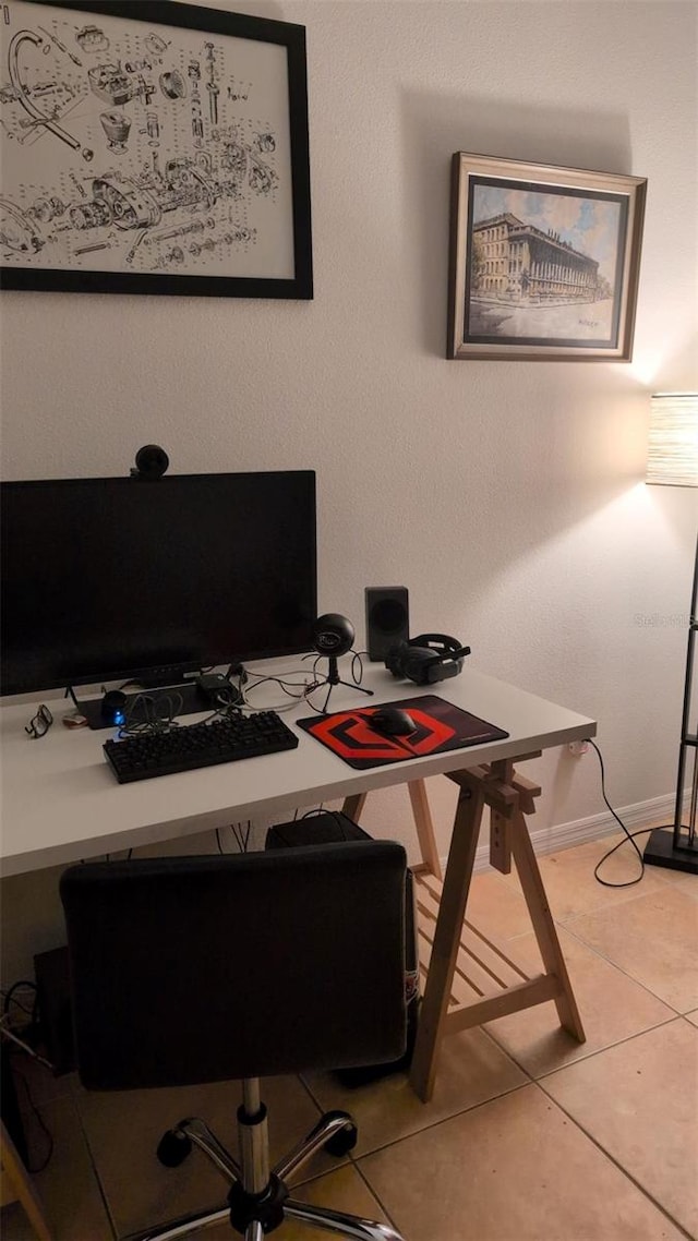 office featuring baseboards and light tile patterned flooring