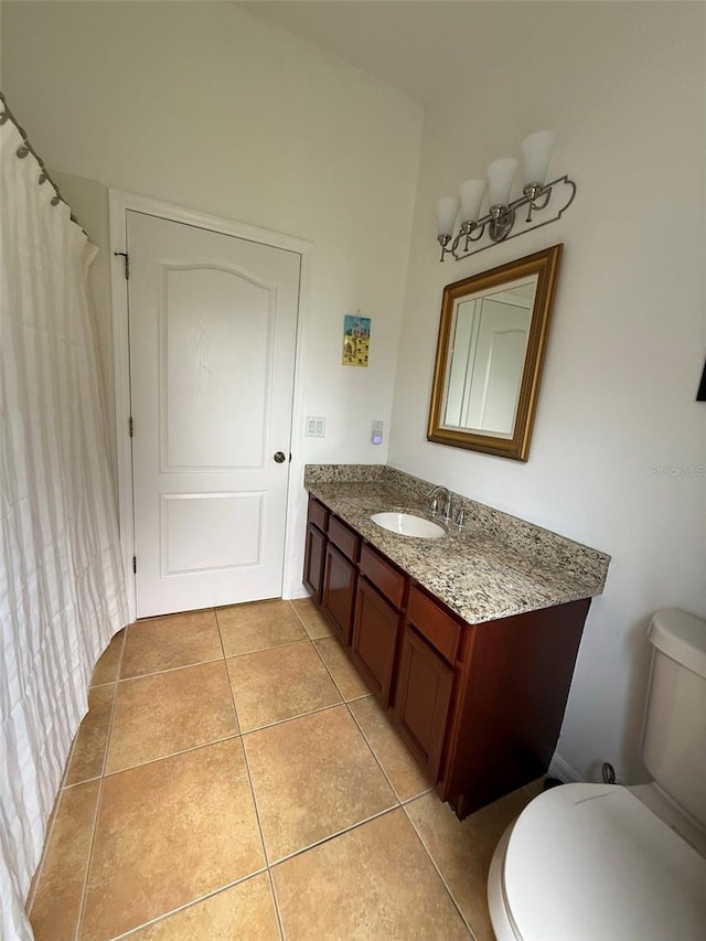 4920 E Lake Cove Blvd, Saint Cloud, FL 34771 - full bath with toilet, vanity, and tile patterned floors