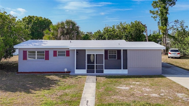 22131 Bahama Ave, Port Charlotte, FL 33952 - view of front of property featuring a sunroom and a front lawn