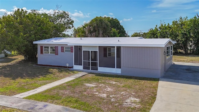 22131 Bahama Ave, Port Charlotte, FL 33952 - back of property featuring a lawn and a sunroom