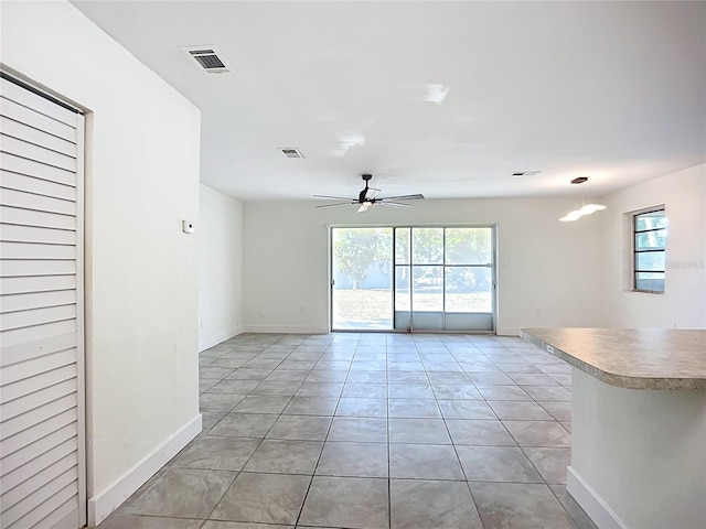22131 Bahama Ave, Port Charlotte, FL 33952 - unfurnished room featuring light tile patterned floors, baseboards, ceiling fan, and visible vents