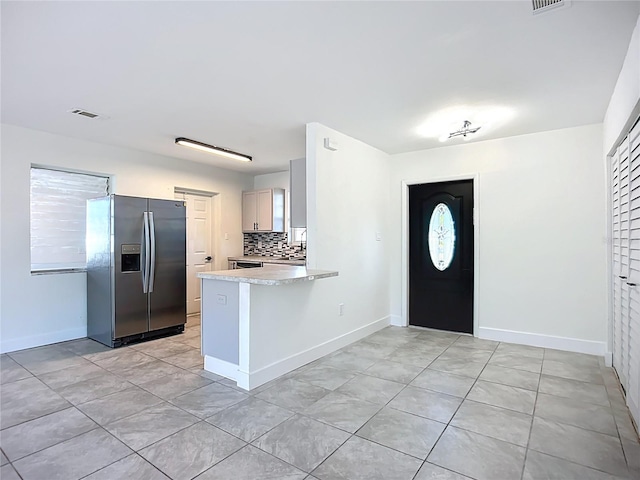 22131 Bahama Ave, Port Charlotte, FL 33952 - foyer featuring baseboards, light tile patterned flooring, and visible vents