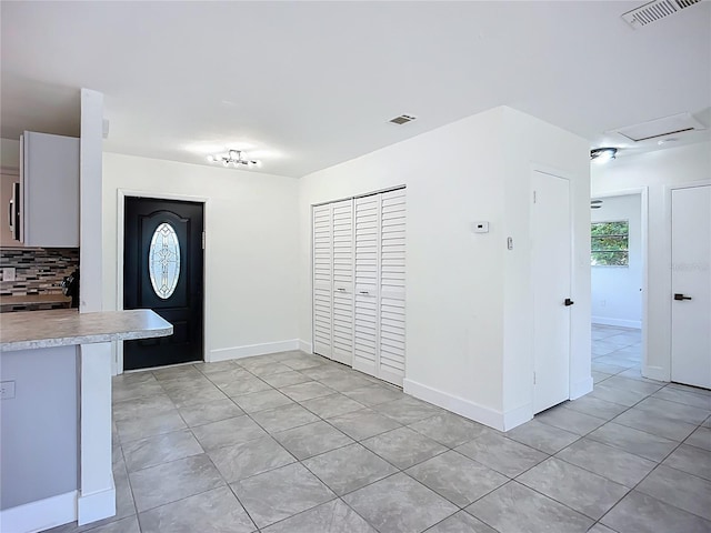 22131 Bahama Ave, Port Charlotte, FL 33952 - entrance foyer featuring baseboards, visible vents, and light tile patterned floors