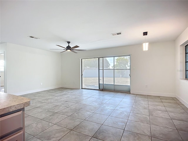 22131 Bahama Ave, Port Charlotte, FL 33952 - unfurnished room featuring light tile patterned floors, baseboards, ceiling fan, and visible vents