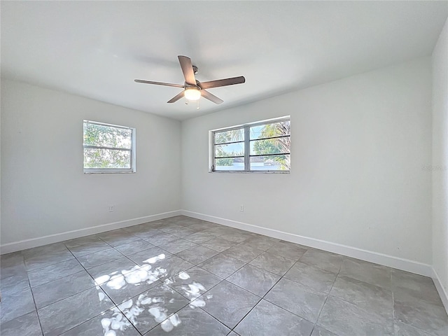 22131 Bahama Ave, Port Charlotte, FL 33952 - unfurnished room featuring baseboards, ceiling fan, and a wealth of natural light