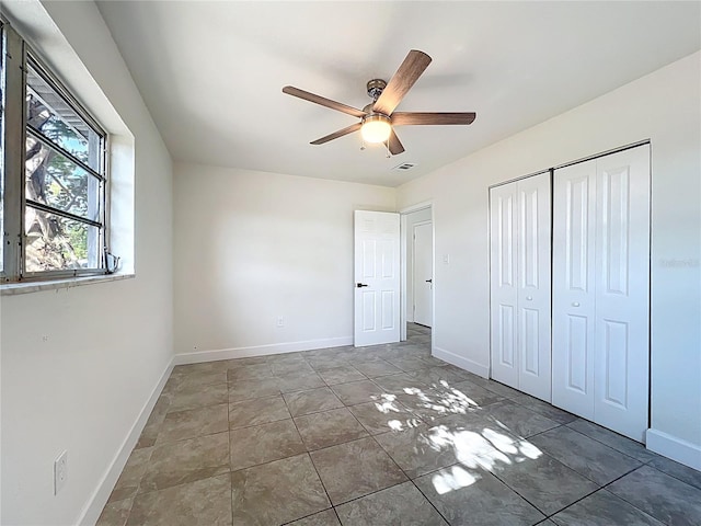 22131 Bahama Ave, Port Charlotte, FL 33952 - unfurnished bedroom with baseboards, a ceiling fan, visible vents, and a closet