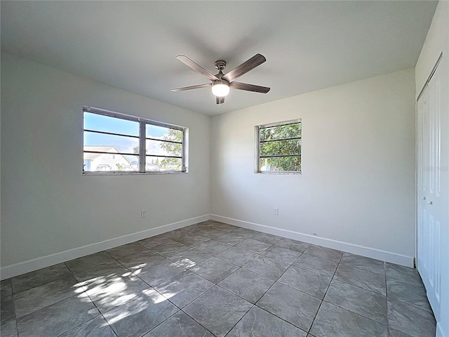 22131 Bahama Ave, Port Charlotte, FL 33952 - spare room featuring baseboards, ceiling fan, and a healthy amount of sunlight