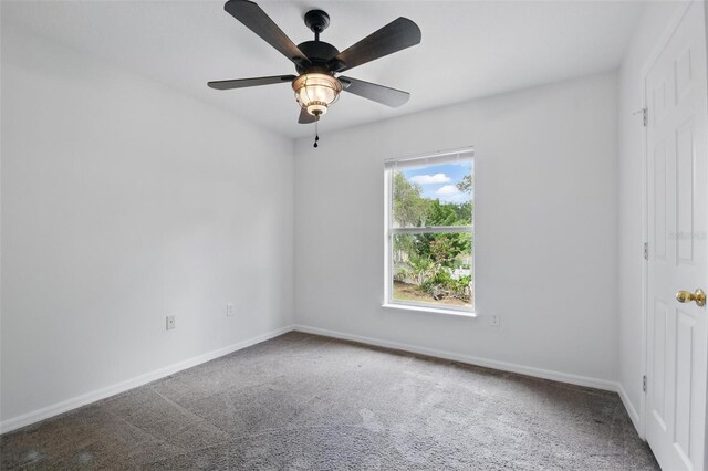 empty room featuring baseboards, carpet, and ceiling fan