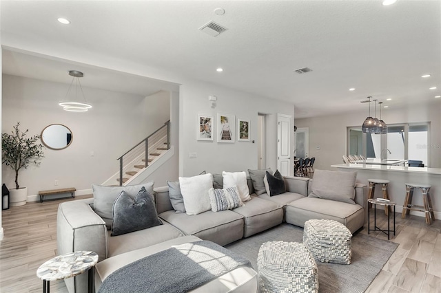 8848 Bismarck Palm Dr, Winter Garden, FL 34787 - living area featuring recessed lighting, stairs, and visible vents