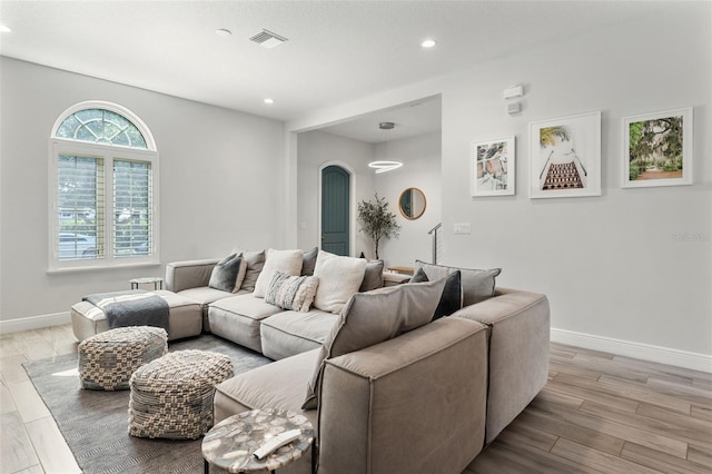 8848 Bismarck Palm Dr, Winter Garden, FL 34787 - living area featuring recessed lighting, baseboards, visible vents, and light wood-type flooring
