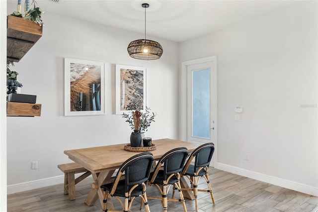 8848 Bismarck Palm Dr, Winter Garden, FL 34787 - dining space with baseboards and light wood-style flooring