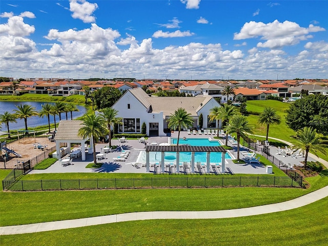 8848 Bismarck Palm Dr, Winter Garden, FL 34787 - community pool with a lawn, fence, a residential view, and a gazebo