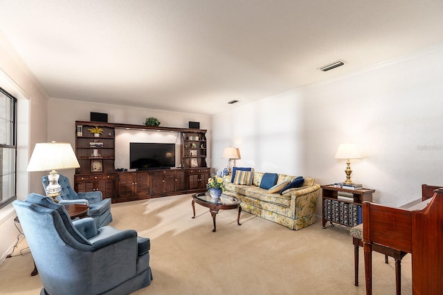 carpeted living room featuring ornamental molding and visible vents