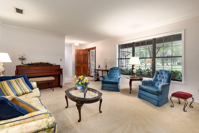 carpeted living area featuring crown molding, baseboards, and visible vents