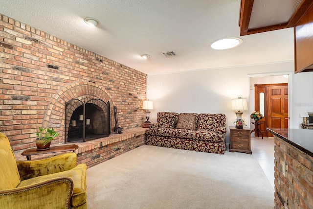 living room featuring light carpet, a fireplace, and visible vents
