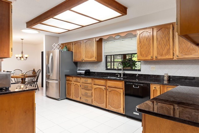 kitchen with a sink, tasteful backsplash, stainless steel refrigerator with ice dispenser, and black dishwasher