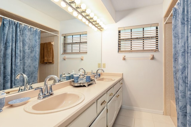 bathroom with double vanity, tile patterned floors, shower / bath combo with shower curtain, and a sink