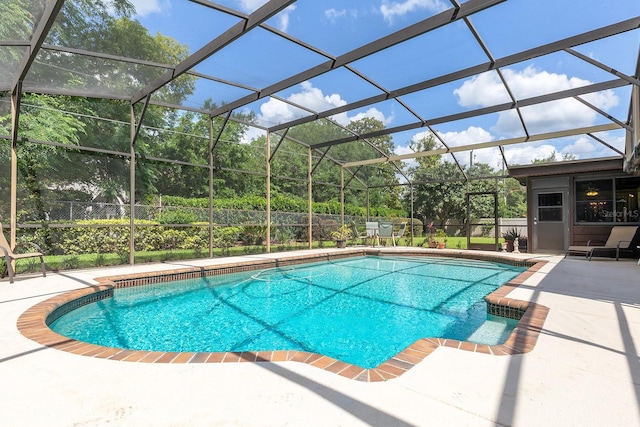 pool with a patio area and a lanai