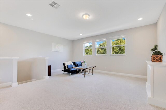 sitting room featuring recessed lighting, an upstairs landing, light carpet, and visible vents