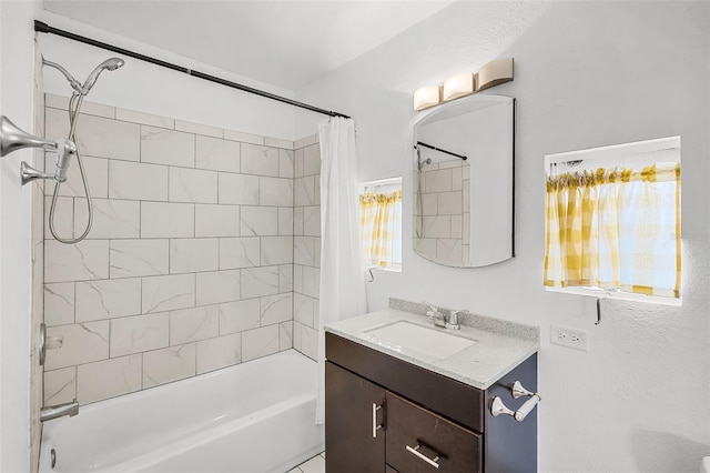 bathroom featuring vanity and shower / tub combo
