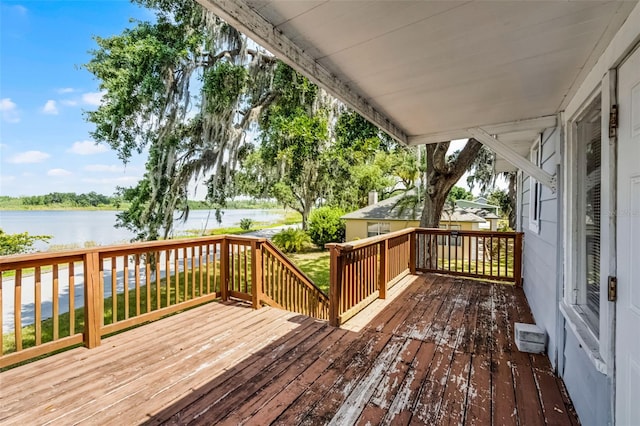 wooden deck featuring a water view