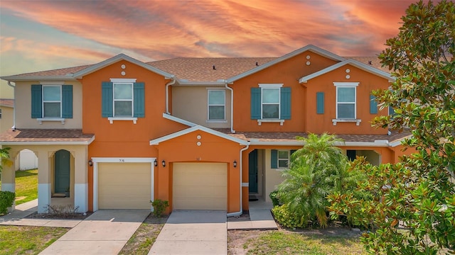 5118 Adelaide Dr, Kissimmee, FL 34746 - townhome / multi-family property with concrete driveway, stucco siding, and a garage