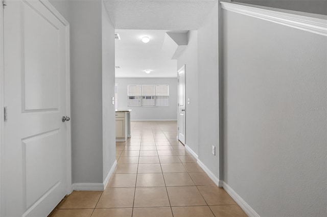 5118 Adelaide Dr, Kissimmee, FL 34746 - hallway featuring light tile patterned floors and baseboards