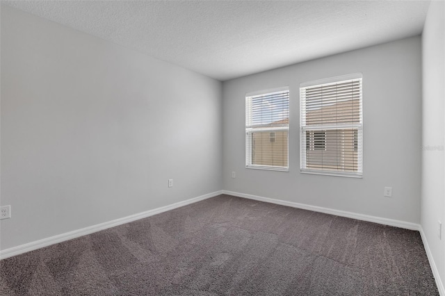 5118 Adelaide Dr, Kissimmee, FL 34746 - carpeted empty room featuring baseboards and a textured ceiling