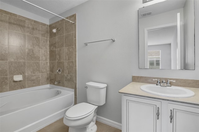 5118 Adelaide Dr, Kissimmee, FL 34746 - bathroom featuring vanity, toilet, baseboards, and shower / tub combination