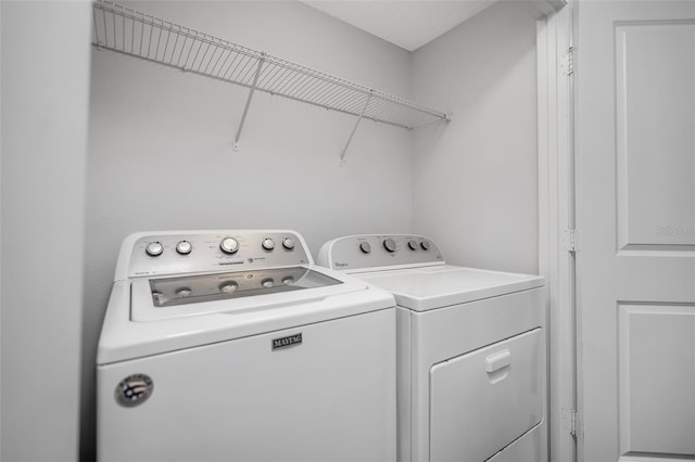5118 Adelaide Dr, Kissimmee, FL 34746 - laundry room with washer and dryer and laundry area