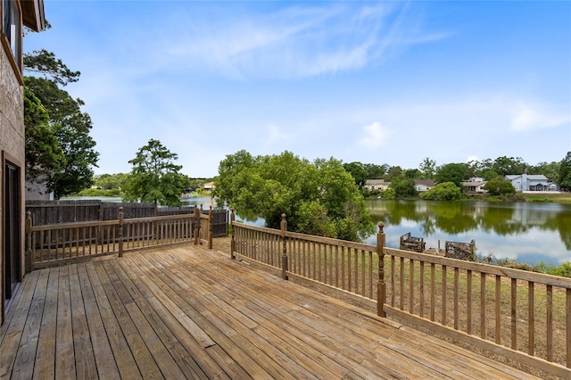 wooden deck with a water view