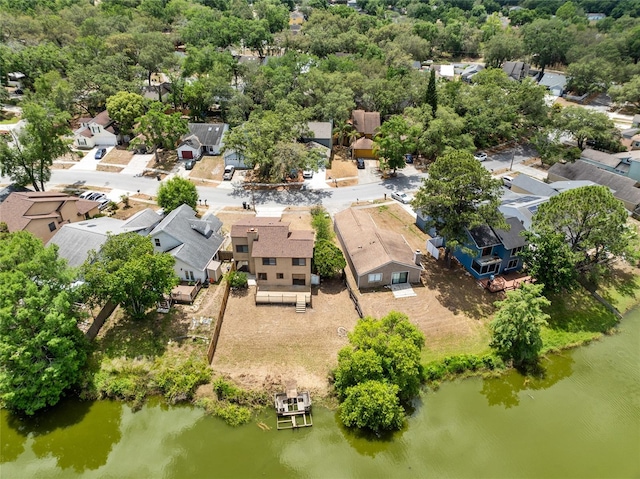 birds eye view of property featuring a water view and a residential view
