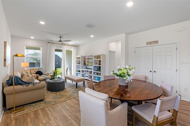 dining space featuring a ceiling fan, recessed lighting, wood finished floors, and visible vents