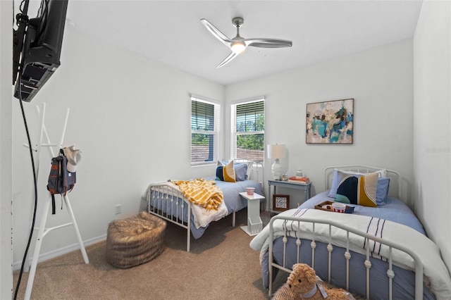 bedroom featuring carpet flooring, ceiling fan, and baseboards