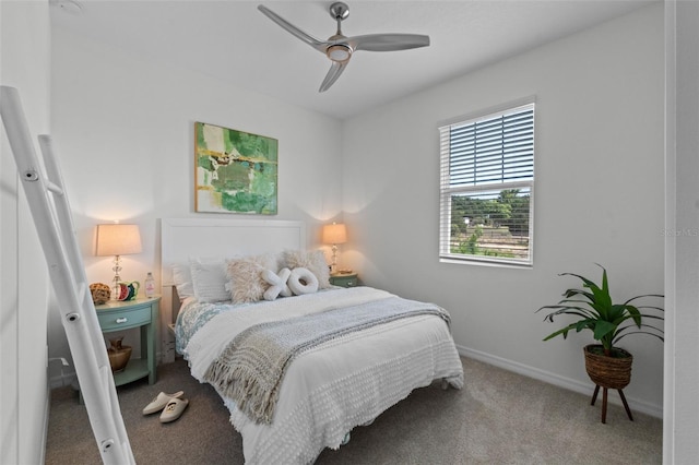 bedroom with a ceiling fan, baseboards, and carpet