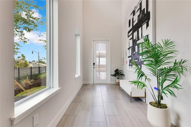 7905 Jacks Club Dr, Kissimmee, FL 34747 - foyer entrance with baseboards and a towering ceiling