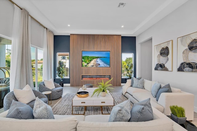 7905 Jacks Club Dr, Kissimmee, FL 34747 - living room featuring a glass covered fireplace and recessed lighting