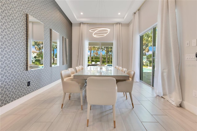7905 Jacks Club Dr, Kissimmee, FL 34747 - dining area with wallpapered walls, an accent wall, healthy amount of natural light, baseboards, and recessed lighting