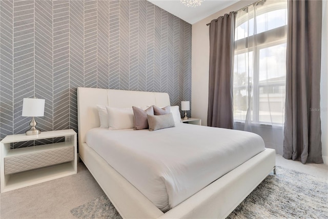 7905 Jacks Club Dr, Kissimmee, FL 34747 - bedroom featuring wallpapered walls, carpet, and an accent wall