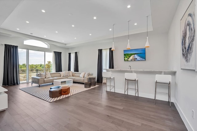 7905 Jacks Club Dr, Kissimmee, FL 34747 - living area featuring wood finished floors, recessed lighting, and baseboards