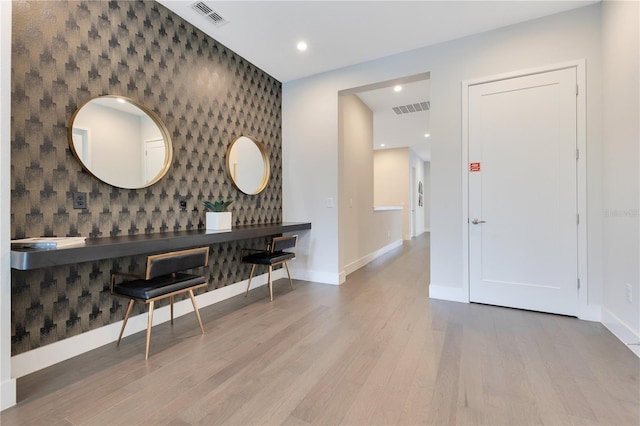 7905 Jacks Club Dr, Kissimmee, FL 34747 - dining area featuring an accent wall, wallpapered walls, baseboards, wood finished floors, and recessed lighting