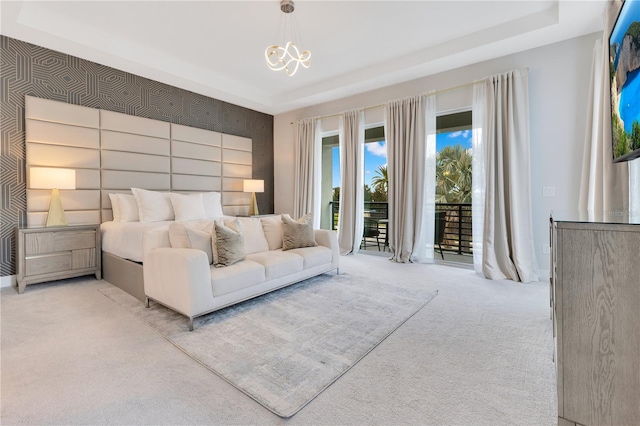7905 Jacks Club Dr, Kissimmee, FL 34747 - carpeted bedroom with access to outside, a tray ceiling, and a chandelier
