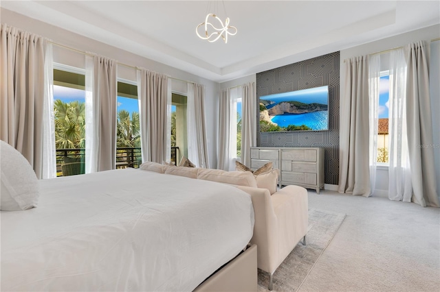 7905 Jacks Club Dr, Kissimmee, FL 34747 - bedroom with carpet floors, a tray ceiling, and a chandelier