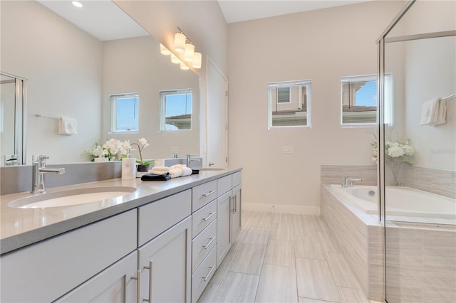 7905 Jacks Club Dr, Kissimmee, FL 34747 - bathroom featuring double vanity, plenty of natural light, a bath, and a shower stall