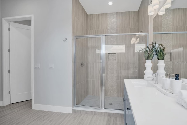 7905 Jacks Club Dr, Kissimmee, FL 34747 - bathroom with a shower stall, vanity, and baseboards