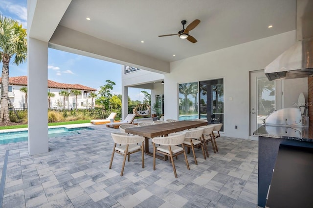 7905 Jacks Club Dr, Kissimmee, FL 34747 - view of patio featuring area for grilling, a ceiling fan, an outdoor pool, and outdoor dining area
