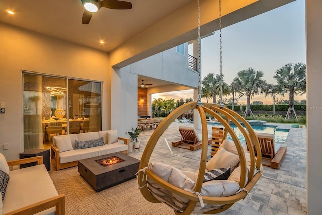7905 Jacks Club Dr, Kissimmee, FL 34747 - view of patio with a ceiling fan, an outdoor living space with a fire pit, and a pool with connected hot tub