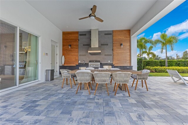 7905 Jacks Club Dr, Kissimmee, FL 34747 - view of patio with outdoor dining space, an outdoor kitchen, area for grilling, ceiling fan, and a sink