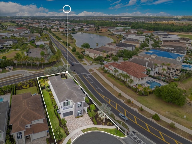 7905 Jacks Club Dr, Kissimmee, FL 34747 - aerial view of property and surrounding area with a large body of water, property parcel outlined, and nearby suburban area