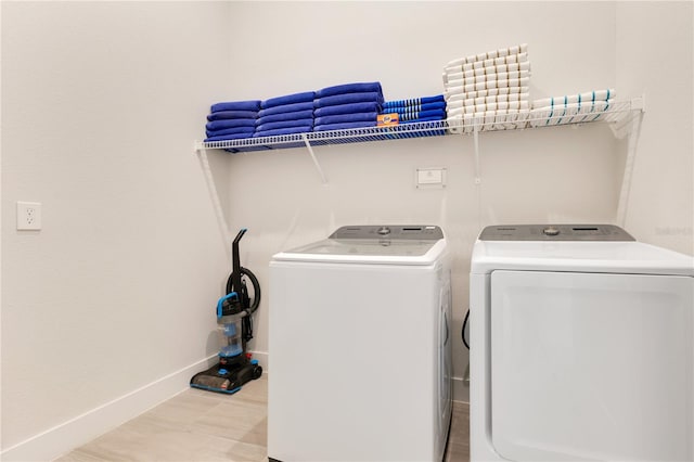 7905 Jacks Club Dr, Kissimmee, FL 34747 - clothes washing area featuring washer and dryer and baseboards